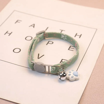 Adjustable Pet Collar with Bell - Colorful Paw Print for Cats & Puppies