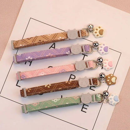 Adjustable Pet Collar with Bell - Colorful Paw Print for Cats & Puppies